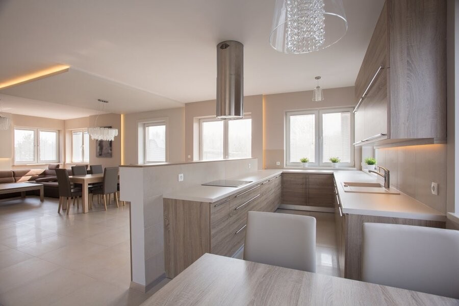 A luxurious open living space connecting a kitchen area with a living room.